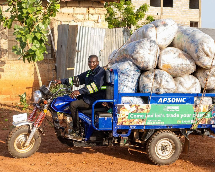 A collector delivering sacks of plastic by tricycle to an ASASE Foundation site